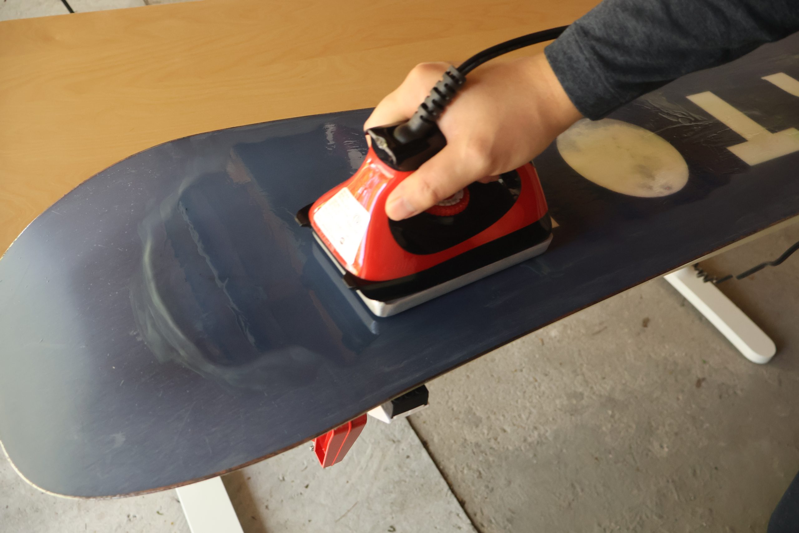 Applying a thick layer of storage wax, spreading it out with an iron