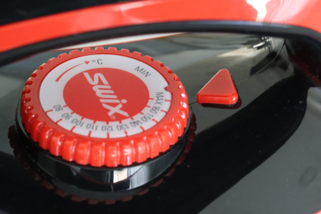 picture of a waxing iron temperature dial. Highlighting the importance of temperature control and stability